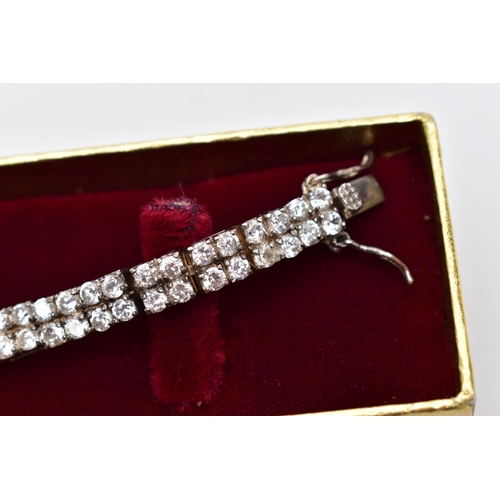 78 - A SILVER CUBIC ZIRCONIA LINE BRACELET AND A SILVER BAR, the bracelet designed with two lines of circ... 