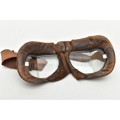 84 - A PAIR OF WWI FLYING GOGGLES, with brown leather surround, clear glass angled lenses and grey painte... 