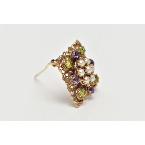 9 - A 9CT GOLD PERIDOT, AMETHYST AND SPLIT PEARL BROOCH, of openwork floral design, the center set with ... 