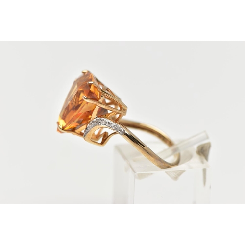 111 - A 9CT GOLD CITRINE AND DIAMOND DRESS RING, the raised triangular cut citrine, with single cut diamon... 