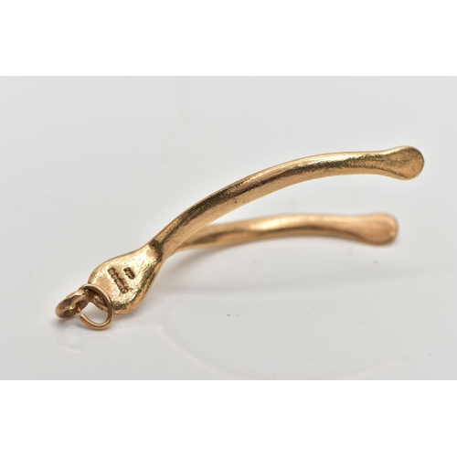 123 - A 1970s 9CT YELLOW GOLD WISH BONE PENDANT, the pendant of plain polished design, approximate length ... 