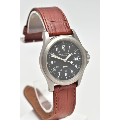 140 - A HAMILTON QUARTZ WRISTWATCH, the black dial, with white Arabic numerals, illuminous white hands, da... 