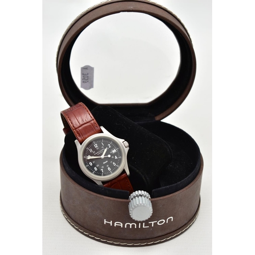 140 - A HAMILTON QUARTZ WRISTWATCH, the black dial, with white Arabic numerals, illuminous white hands, da... 