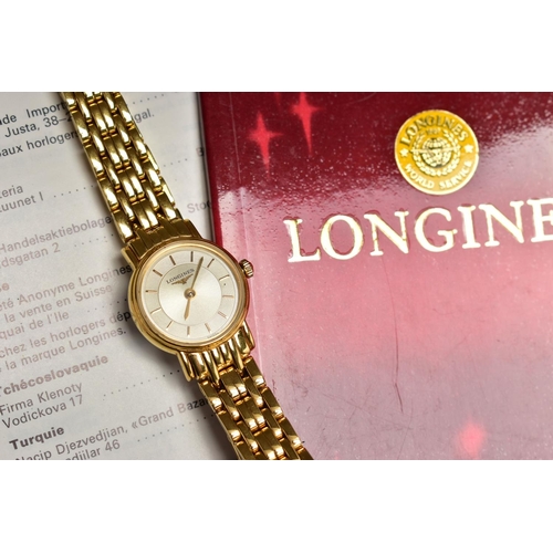 149 - A LADIES AND A GENTS 'LONGINES' WRISTWATCH, a gents quartz watch featuring a round gold dial signed ... 