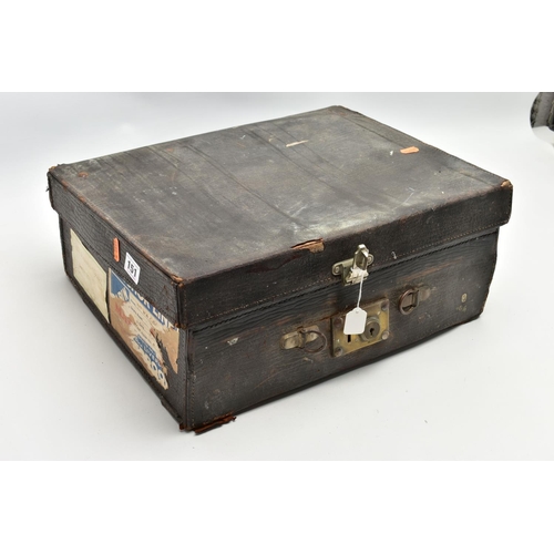 151 - A WORN TRAVEL VANITY CASE WITH VANITY PIECES, brown leather case with metal lock fittings, opens to ... 