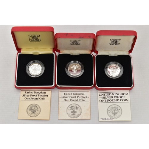 22 - ROYAL MINT BOXED SILVER PROOF PIEDFORT ONE POUND COINS 1984,1985,1986 all in Royal Mint cases with c... 