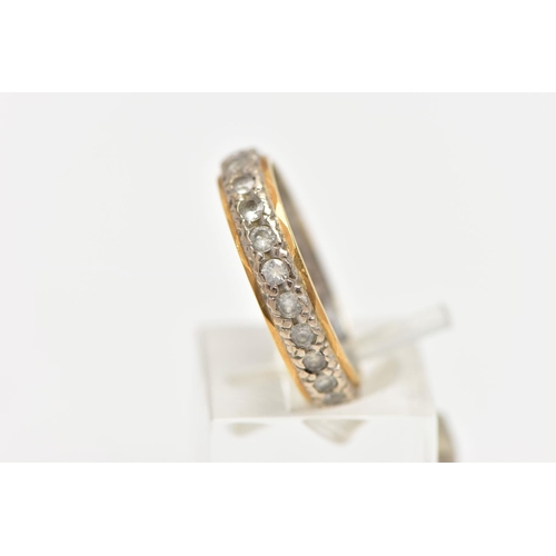 84 - A PASTE FULL ETERNITY RING, the circular cut paste full eternity band ring, with yellow metal edging... 