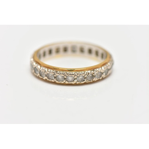 84 - A PASTE FULL ETERNITY RING, the circular cut paste full eternity band ring, with yellow metal edging... 