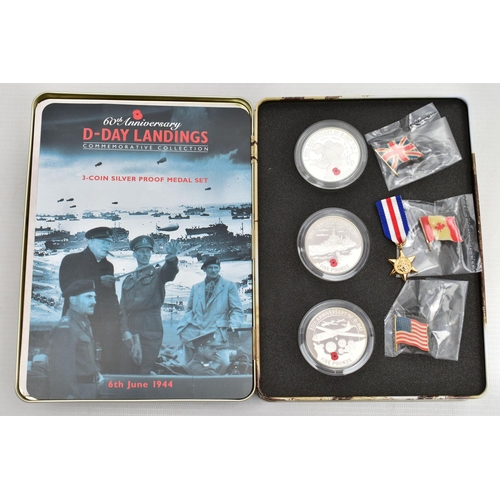 9 - THE 60th ANNIVERSARY D-DAY LANDINGS SET, to include a collection of three silver proof £5 Crowns of ... 