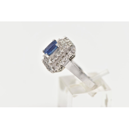 97 - A SAPPHIRE AND DIAMOND CLUSTER RING, set with a rectangular cushion shape sapphire, measuring approx... 