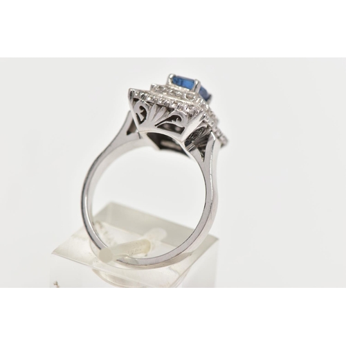 97 - A SAPPHIRE AND DIAMOND CLUSTER RING, set with a rectangular cushion shape sapphire, measuring approx... 