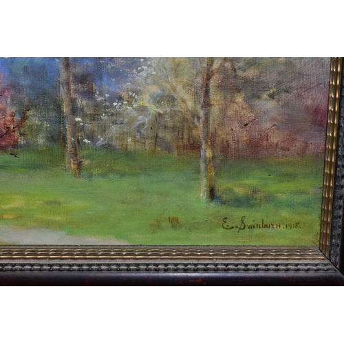 354 - E. SWINBURN (19TH CENTURY) AN IMPRESSIONIST STYLE LANDSCAPE, a path flanked by trees leads to low bu... 