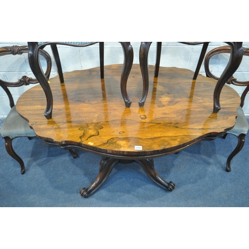 1292 - A VICTORIAN ROSEWOOD BREAKFAST TABLE, with a wavy top, on four scrolled legs and casters, length 137... 