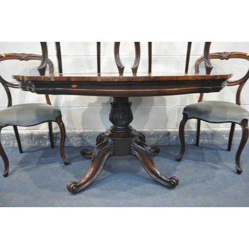 1292 - A VICTORIAN ROSEWOOD BREAKFAST TABLE, with a wavy top, on four scrolled legs and casters, length 137... 