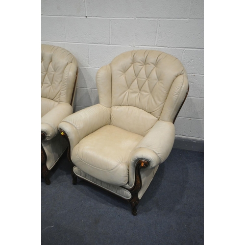 1300 - A GEMALINEA CREAM LEATHER FOUR PIECE LOUNGE SUITE, comprising a two seater settee, and three armchai... 