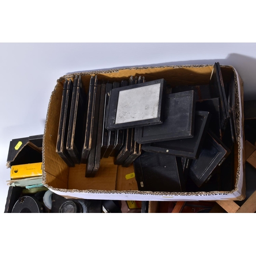 22 - FIVE TRAYS CONTAINING VINTAGE FIELD CAMERA AND TRIPOD PARTS including plate carriers, a lens carriag... 