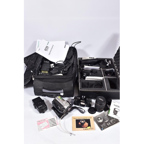 24 - AN ALUMINIUM CASE AND A SUITCASE CONTAINING CAMERA EQUIPMENT including a Canon A-1 Film SLR body , a... 