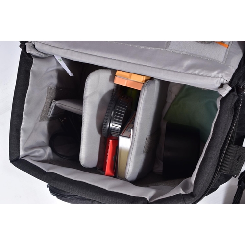 29 - A LOWEPRO CAMERA BAG CONTAINING A CANON EOS 550D DIGITAL SLR CAMERA with two batteries, charger ) no... 