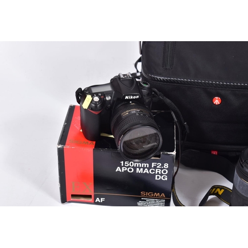 33 - A MANFROTTO CAMERA RUCK SACK CONTAINING A NIKON D90 DIGITAL SLR CAMERA with charger,  cable and one ... 