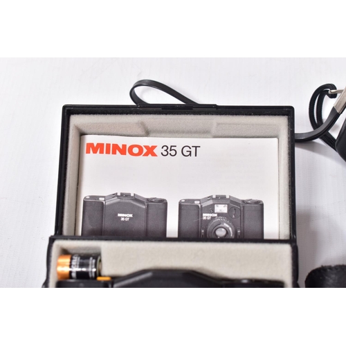 40 - A MINOX 35GT FILM CAMERA in case with a leather pouch
