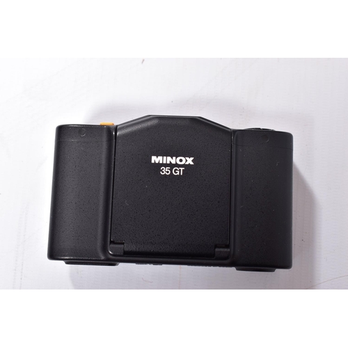 40 - A MINOX 35GT FILM CAMERA in case with a leather pouch