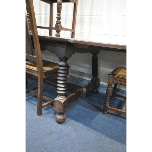 1192 - AN FRENCH BRETON DRAW LEAF DINING TABLE, on a trestle base and stretcher, extended length 260cm x cl... 