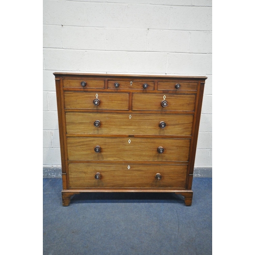 1198 - A GEORGE III WALNUT CHEST OF DRAWERS, with an unusual configuration of three small drawers, above tw... 