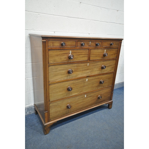 1198 - A GEORGE III WALNUT CHEST OF DRAWERS, with an unusual configuration of three small drawers, above tw... 