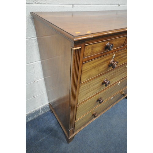 1198 - A GEORGE III WALNUT CHEST OF DRAWERS, with an unusual configuration of three small drawers, above tw... 