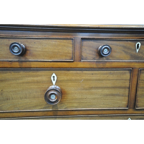 1198 - A GEORGE III WALNUT CHEST OF DRAWERS, with an unusual configuration of three small drawers, above tw... 