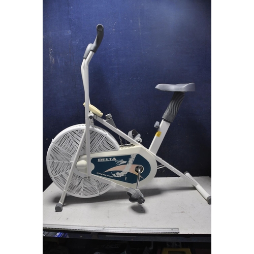 1055 - A REEBOK PURE CROSSTRAINER along with a Delta explorer spin bike (2)