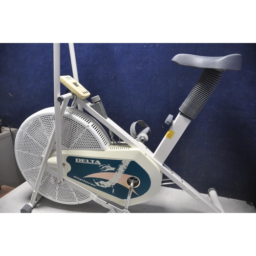 1055 - A REEBOK PURE CROSSTRAINER along with a Delta explorer spin bike (2)