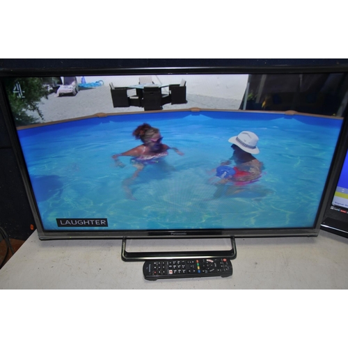 1068 - A PANASONIC TX-32FS500B 32in TV with remote along with E-motion W216/69G-GB with no remote (both PAT... 