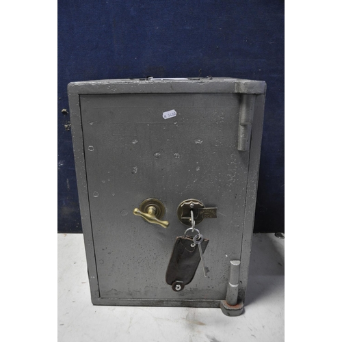 1070 - A CAST IRON SAFE bearing no makers name or model, with two keys