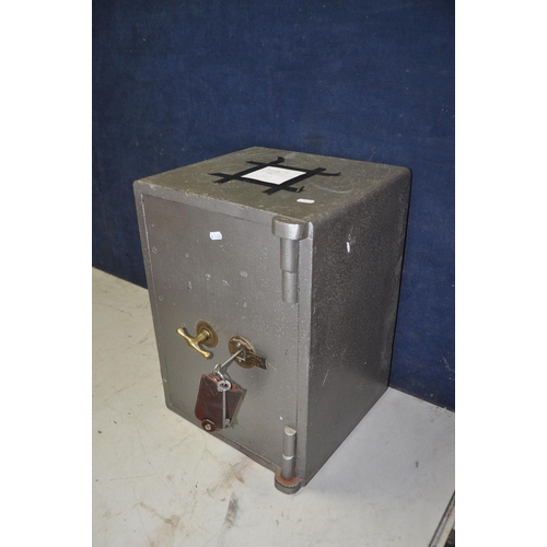 1070 - A CAST IRON SAFE bearing no makers name or model, with two keys