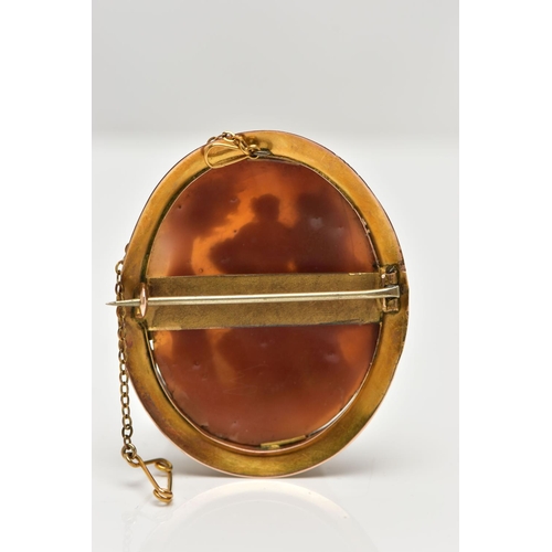 10 - A MID 19TH CENTURY YELLOW METAL CAMEO BROOCH, the shell cameo, carved in high relief, depicting Cupi... 