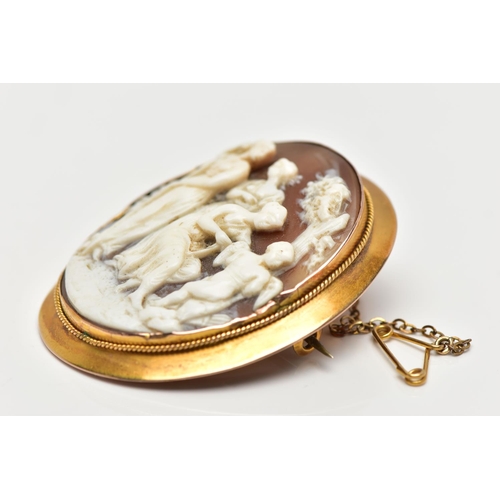 10 - A MID 19TH CENTURY YELLOW METAL CAMEO BROOCH, the shell cameo, carved in high relief, depicting Cupi... 