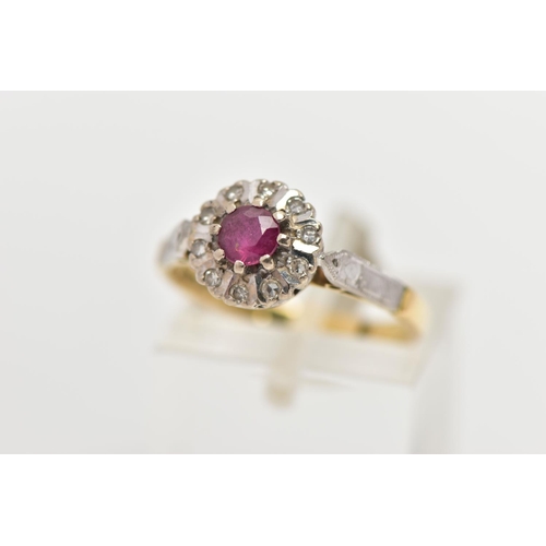 11 - A MID 20TH CENTURY 18CT GOLD RUBY AND DIAMOND CLUSTER RING, set with a circular cut ruby, measuring ... 