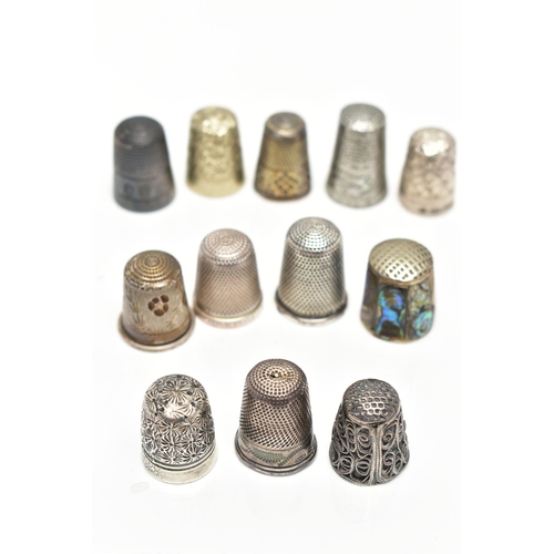 30 - TWELVE THIMBLES, to include six with silver hallmarks, approximate gross weight 27.0 grams, six othe... 