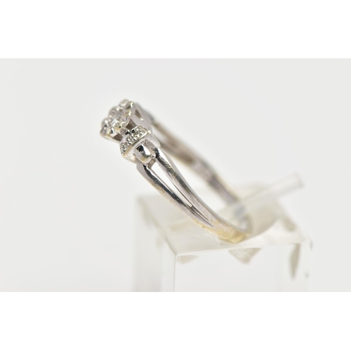 35 - A 9CT WHITE GOLD DIAMOND RING, centering on an illusion set round brilliant cut diamond, flanked wit... 