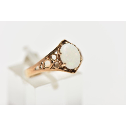 36 - A 9CT GOLD OPAL RING, designed with an oval opal cabochon in a six claw setting, openwork detailed s... 