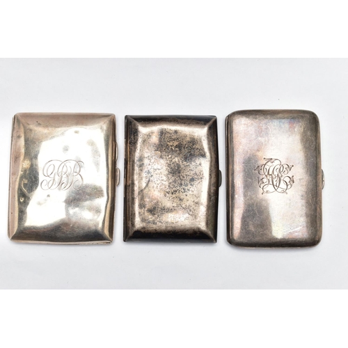 38 - THREE SILVER CIGARETTE CASES, the first of a curved rectangular form, plain polished design with eng... 