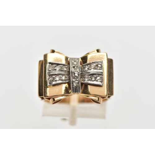 5 - A YELLOW METAL AND DIAMOND DRESS RING, designed as a large bow, fifteen rose cut diamonds set into a... 