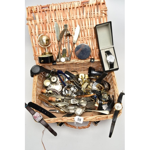 59 - A WICKER BASKET WITH ITEMS, items to include various ladies and gents fashion wristwatches mostly qu... 