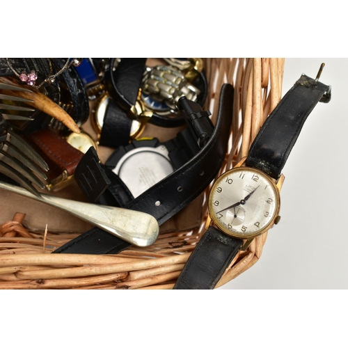 59 - A WICKER BASKET WITH ITEMS, items to include various ladies and gents fashion wristwatches mostly qu... 