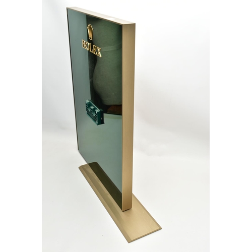 92 - A 'ROLEX' SHOP WINDOW DISPLAY STAND, rectangular form, one side display a plastic green mirrored fin... 