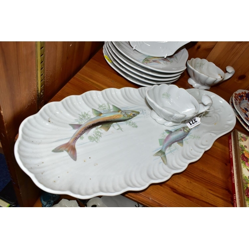 371 - A MODERN PORCELAINE DE SOLOGNE FISH SET, comprising serving platter, two sauce boats and six shell s... 