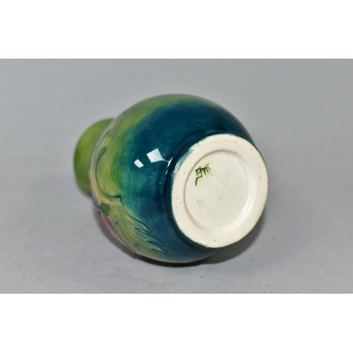 413 - A SMALL MOORCROFT POTTERY BALUSTER VASE, tube lined in Anemone pattern on a graduated green ground, ... 