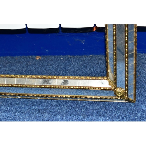 427 - A MIRRORED PICTURE FRAME, with gilt edges and foliate detail, height 150cm x width 85cm (1)