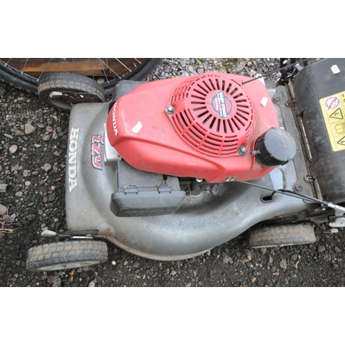 1002 - A HONDA IZY GCV160 PETROL LAWN MOWER (engine pulls freely and starts) Condition Front wheel bent